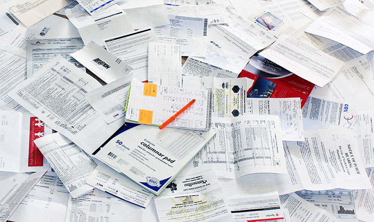 pile of paperwork for calculating fixed asset depreciation