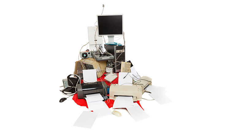 image of stack of computer devices for the article "does a fixed asset depreciaite"