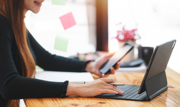 close up of person using devices for the article "what is mobile device management"