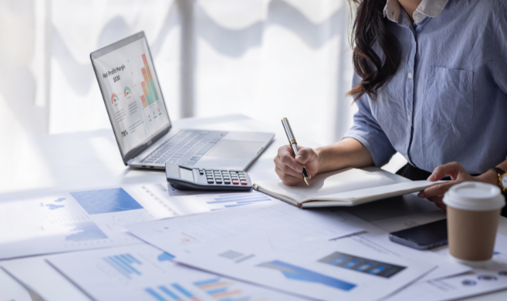 woman working at desk figuring out which asset cannot be depreciated