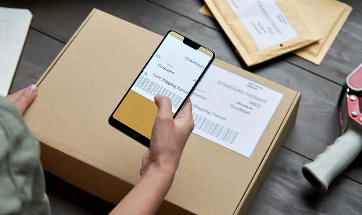 employee learning how a mobile barcode scanner works