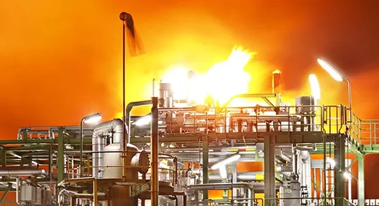 Industrial processing plant lit up at night