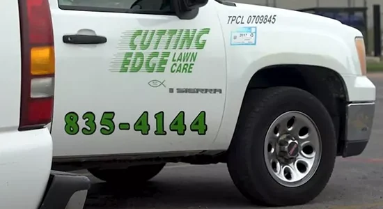 Cutting Edge Lawn Care work truck with the company logo on the door