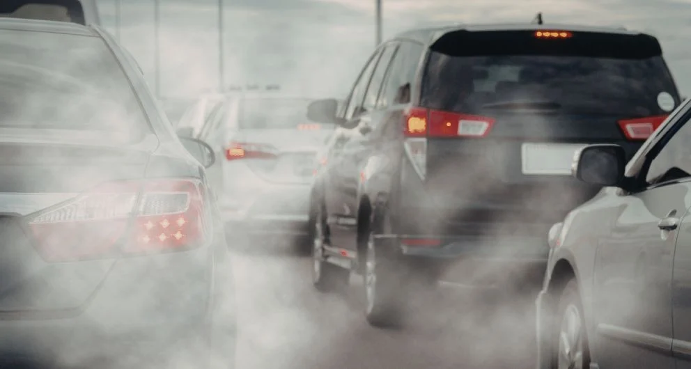 Vehicles on a highway in heavy exhaust