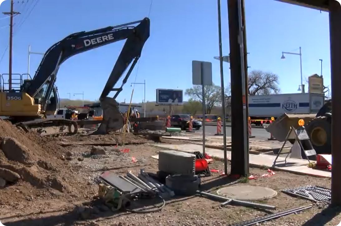 Public works crew working at a road and utility construction site