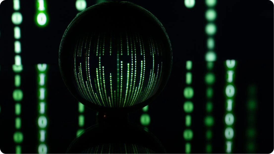 Glass sphere reflecting green digital code