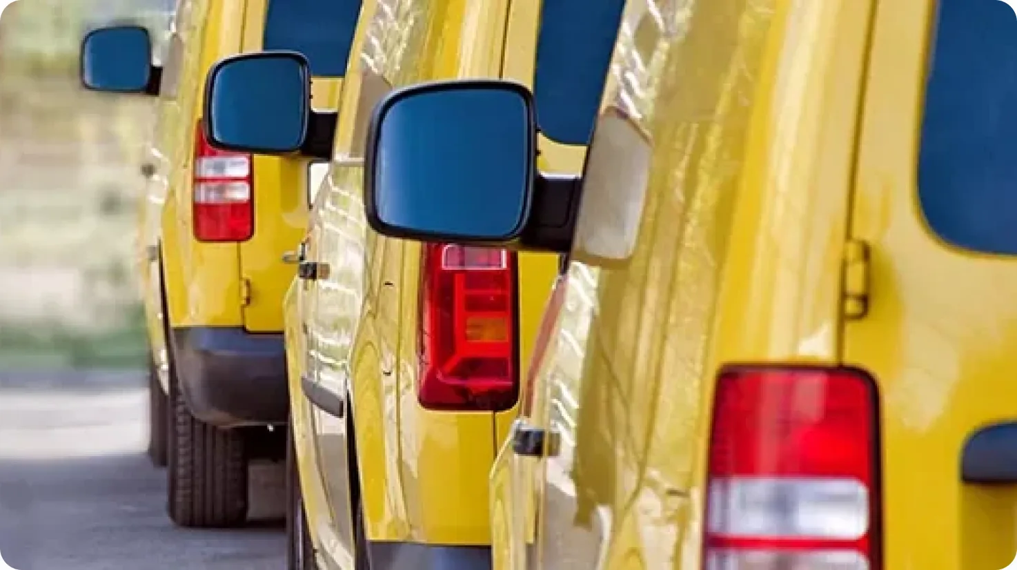 Row of yellow A3 Communications service vans