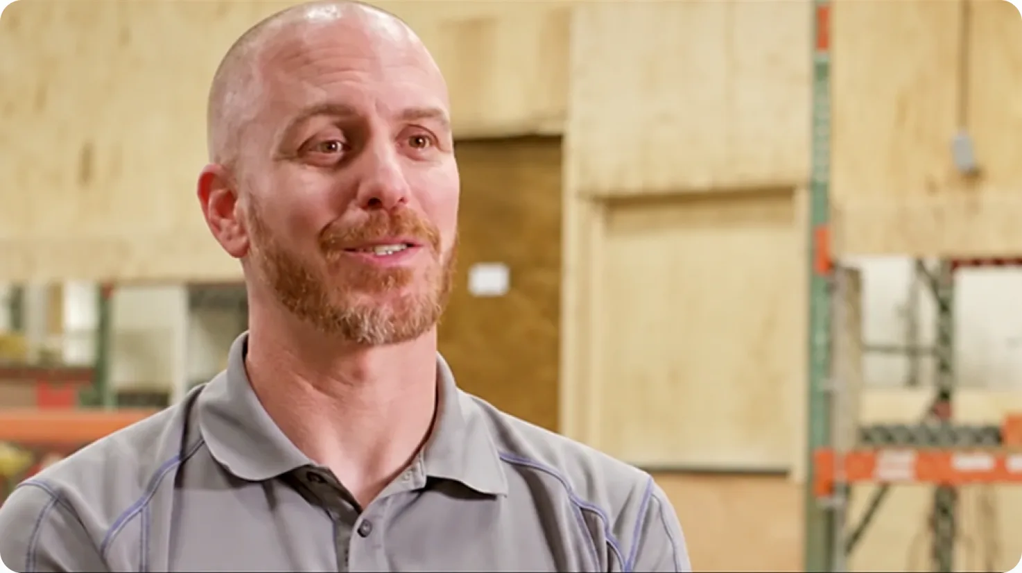 Brian Bruni of Track Utilities speaking in a warehouse