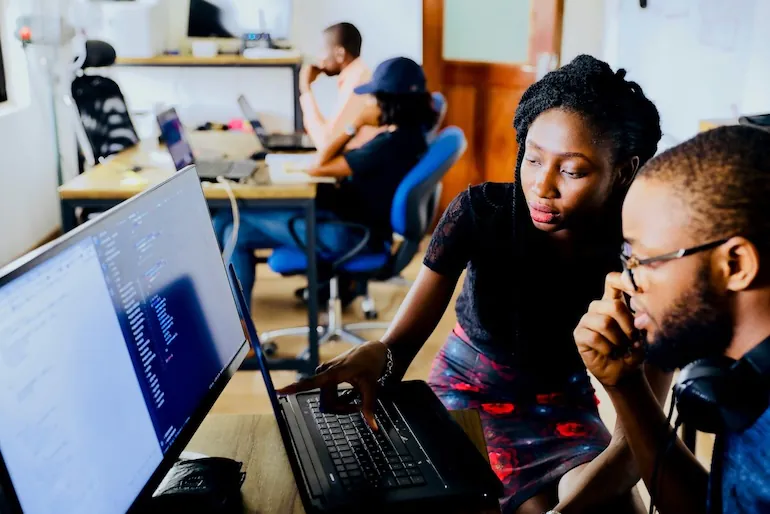 coworkers preparing questions to ask while choosing an asset software