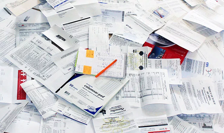 pile of paperwork for calculating fixed asset depreciation